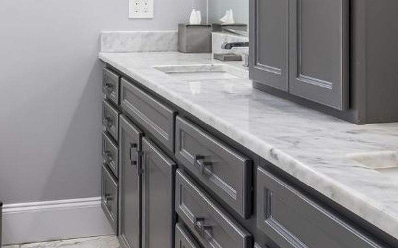 Grey shaker vanity with a marble-look countertop